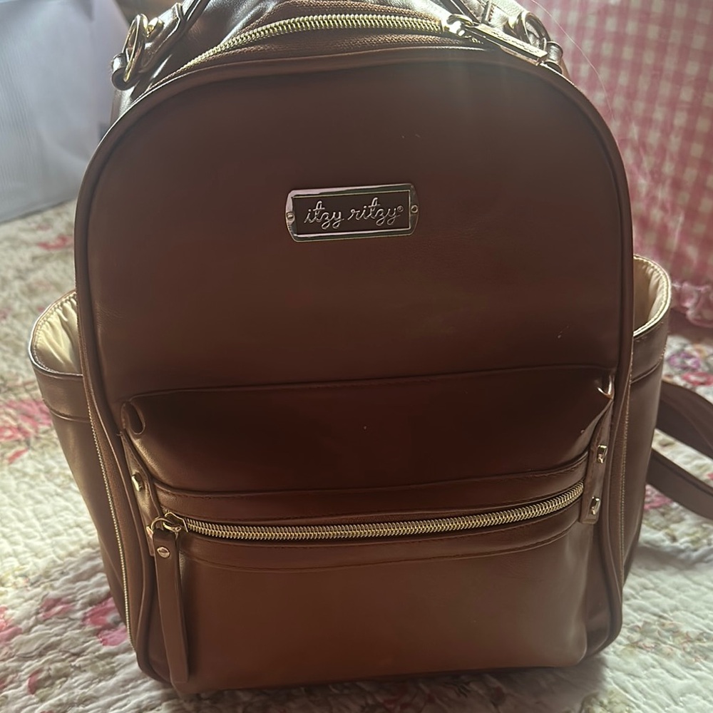 Itzy Ritzy Brown Backpack with Gold Zippers and Structured Design